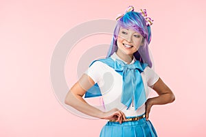 Otaku girl in sailor suit smiling isolated on pink