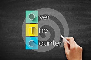 OTC - Over The Counter acronym, medical concept background on blackboard