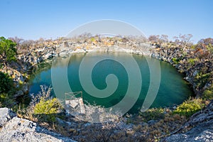 Otjikoto Lake, one of the only two permanent natural lake in Namibia, famous travel destination in Africa. Ultra wide view.