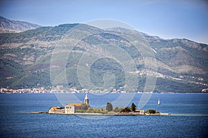 Otok Island (Gospa od Milosti) with Jesuit monastery and church of the Blessed Virgin, Tivat Bay, Montenegro photo