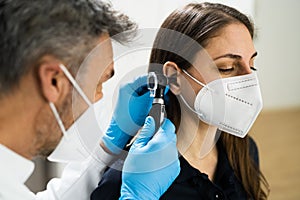 Otolaryngology Doctor Examining Patient Ear