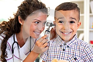 Otoscope ear examination performed by a young doctor