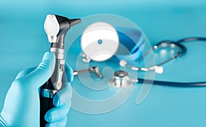 Otoscope, stethoscope, and reflector for detecting disorders of the patient photo