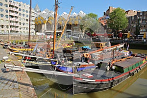 Oudehaven Harbor with colorful historical houseboats and Cube houses Kijk Kubus in the background, Rotterdam photo