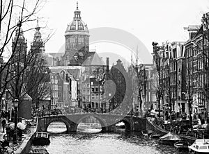 The Oudezijds voorburgwal a street and canal in the Red-light district in the center of Amsterdam.