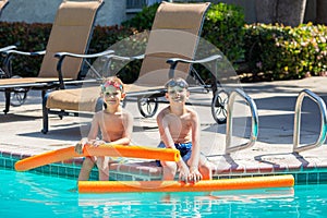 Oudoor summer activity. Concept of fun, health and vacation. Brothers boys eight and five years old in swim glasses with