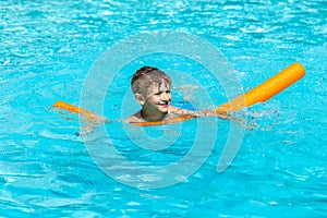 Oudoor summer activity. Concept of fun, health and vacation. Happy smiling boy five years old in swim glasses swim in