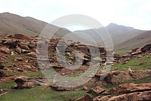 Oukaimeden, shepherds\' huts among mountains and green plains in autumn, Morocco