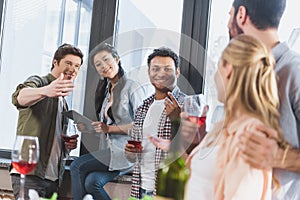 Oung people partying, drinking wine