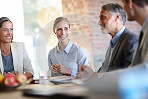 Our boss, the joker. A cropped shot of a group of happy businesspeople having a meeting.