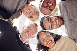 Our diversity is what allows us to excel. Portrait of a group of businesspeople standing together in a huddle.