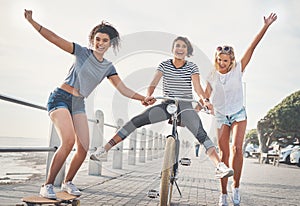 Our favorite things to do is to have fun. three friends having fun on the promenade.