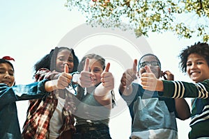 Our favourite summer camp by far. Shot of a group of teenagers showing thumbs up at summer camp.