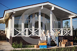 First home swith new home owners on step