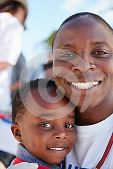 Our kids need lots of love and protection. Portrait of a caring volunteer doctor giving checkups to underprivileged kids