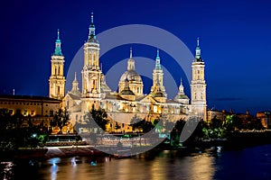 Our Lady of the Pillar Basilica with Ebro River at dusk Zaragoza, Spain