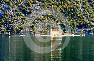 Our Lady of the Rock island and Church in Perast on shore of Boka Kotor bay ,Montenegro