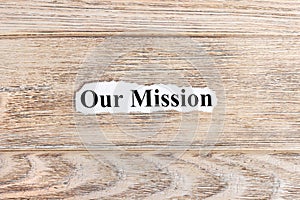 Our Mission text on paper. Word Our Mission on torn paper. Concept Image