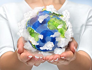 Our planet in our hands. Open hands holding 3d planet earth with