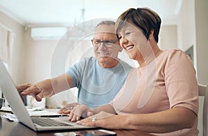 Our plans seem to shaping up. Shot of a mature husband and wife using a laptop together.
