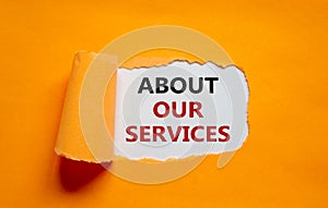 About our services symbol. The words `about our services` appearing behind torn orange paper. Beautiful background. Business and