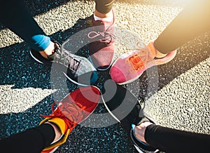 Our shoes fit our personalities. a group of unrecognizable peoples runnings shoes put next to each other in a circle