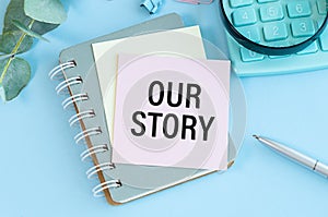 Our story, text words typography written on book against wooden background, life and business motivational inspirational concept