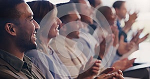 Our success stays on the rise. a group of businesspeople clapping during a conference in an office.