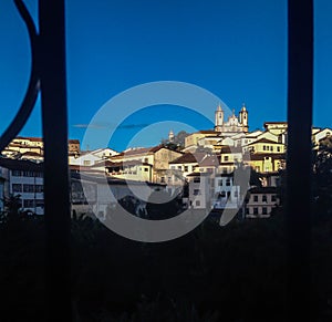 Ouro Preto town in Brazil, cityscape behind a window