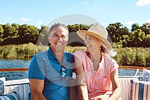 Out for a boat ride with my better half. Portrait of a mature couple enjoying a relaxing boat ride.