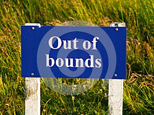 Out of bounds sign on golf course