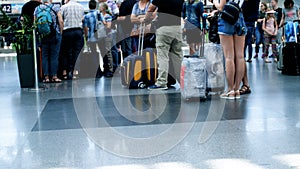 Out of focus 4k footage of people feet and luggage at international airport terminal