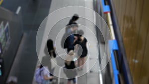 out of focus blur top down view to passengers traveller waiting on subway platform station ready to boarding the train commuter in