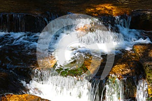 Out of focus, blurred background, cold clear mountain water, mountain river flowing over the stones.