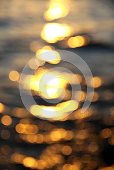 Bokeh background of sea water with sun reflections