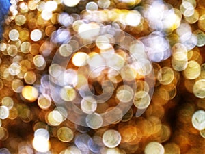 Out of Focus, Defocused, Blurred, Abstract and Bokeh of Sparkling Colorful Gold Lights, Suitable for Background Use