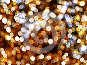 Out of Focus, Defocused, Blurred, Abstract and Bokeh of Sparkling Colorful Gold Lights, Suitable for Background Use