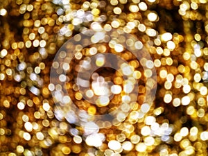 Out of Focus, Defocused, Blurred, Abstract and Bokeh of Sparkling Gold Lights, Suitable for Background Use and Holiday Season