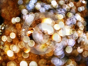 Out of Focus, Defocused, Blurred, Abstract and Bokeh of Sparkling Gold Lights, Suitable for Background Use and Holiday Season