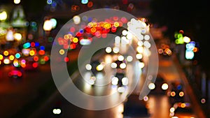 out of focus view of highway steeet with many traffic and bokeh light moving on the road in night time