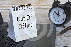 Out of office notification text on white notepad. Out of Office concept