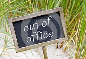 Out of Office Sign on Beach