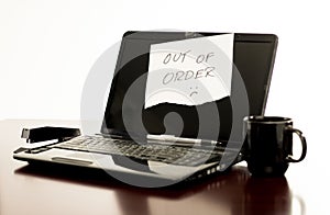 Out Of Order Laptop Computer on Desk