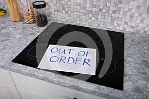 Out Of Order Text Stuck On Induction Stove photo