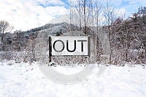 Out sign in snowy landscape, lonely walk in nature, active lifestyle change concept, mind body soul improvement