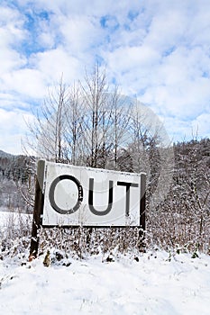 Out sign in snowy landscape, lonely walk in nature, active lifestyle change concept, mind body soul improvement