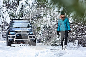 Out in snow covered forest with 4wd ute