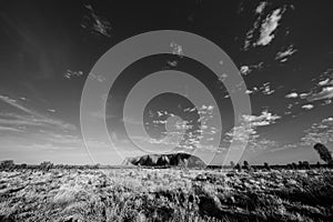 Outback, Australia - November 12, 2022: Sunrise at the Majestic Uluru or Ayers Rock at in the Northern Territory, Australia. The