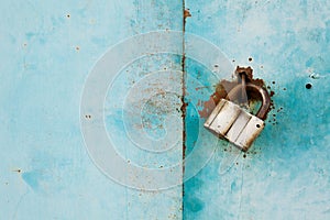 Outboard lock or padlock on vintage turquoise background, protection system concept