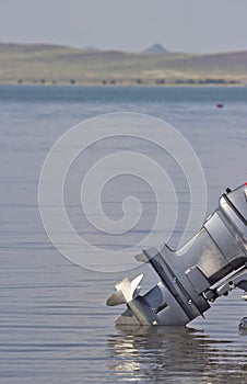 Outboard motor lowered into the water